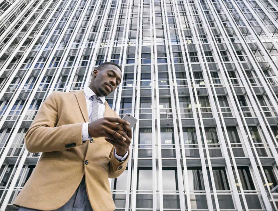businessman checking phone