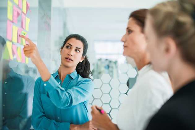 woman pointing at notes